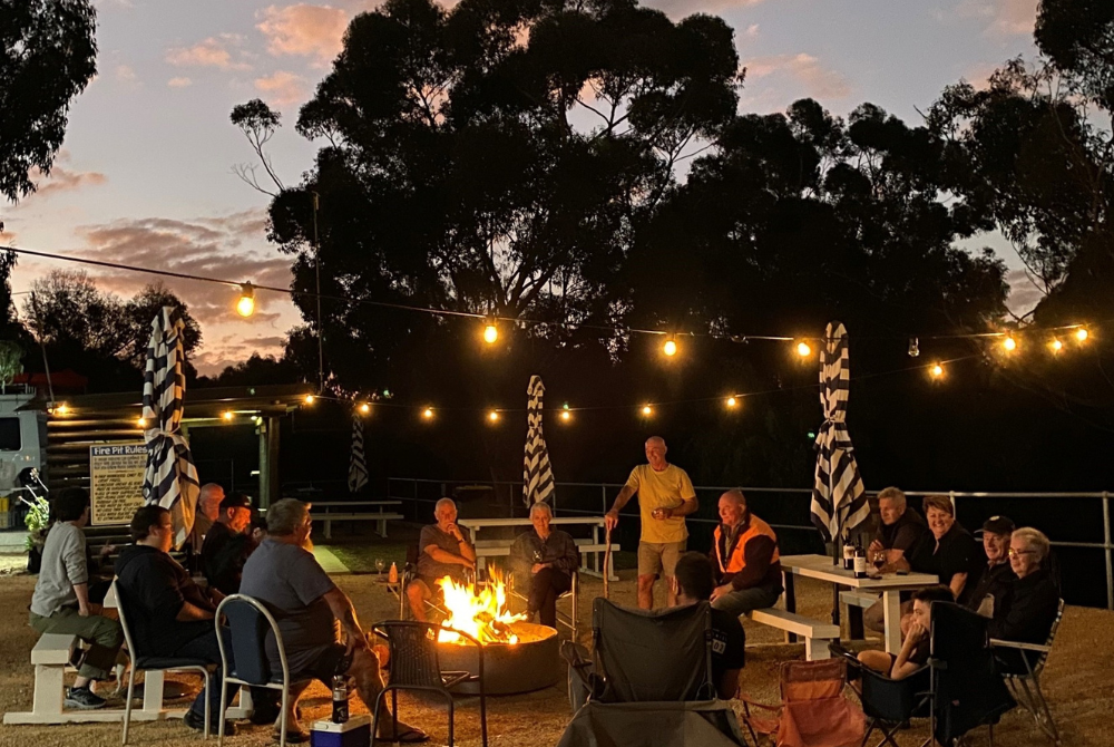guests gathered around the communal firepit at Ardrossan Caravan Park